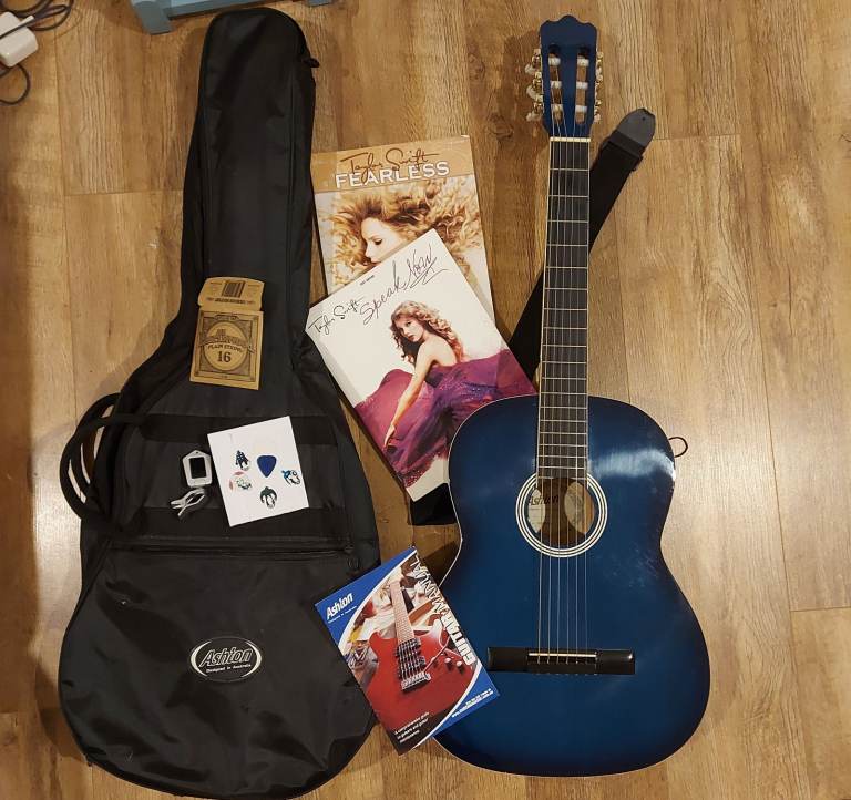 image for Ashton CG44TBB acoustic guitar (blue) and bag/tuner/plectrums/Taylor Swift music books