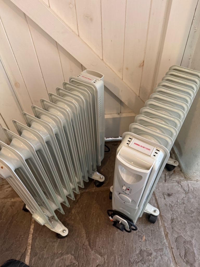 Two off White Oil-Filled Radiators on Wheels 