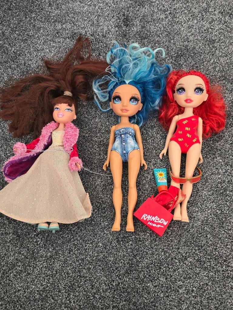 Three Fashion Dolls with Clothes and Accessories