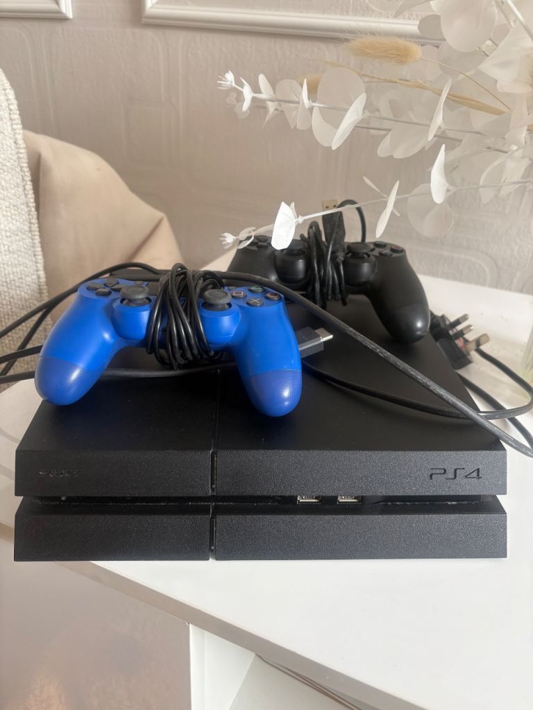 Sony PlayStation 4 (PS4) Console with 9 games a couple unopened 2 Controllers