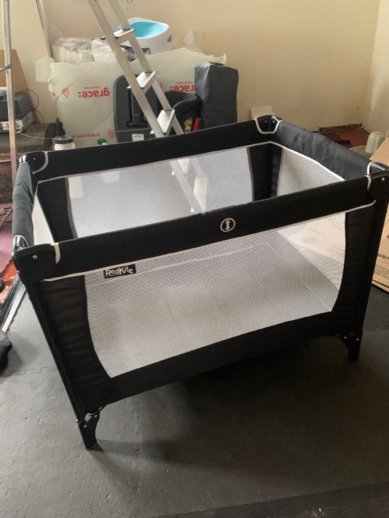 Red kite travel cot