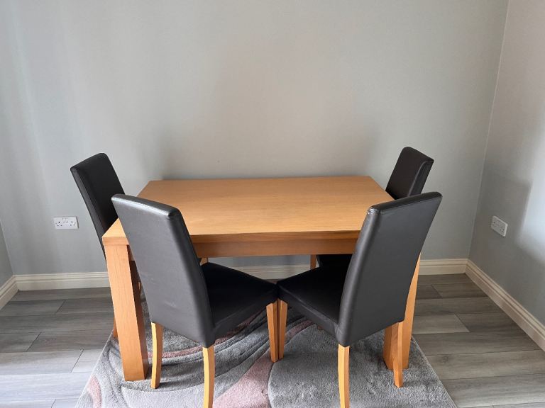 Wooden Dining Table with 4 Black Faux Leather Chairs – Good Condition
