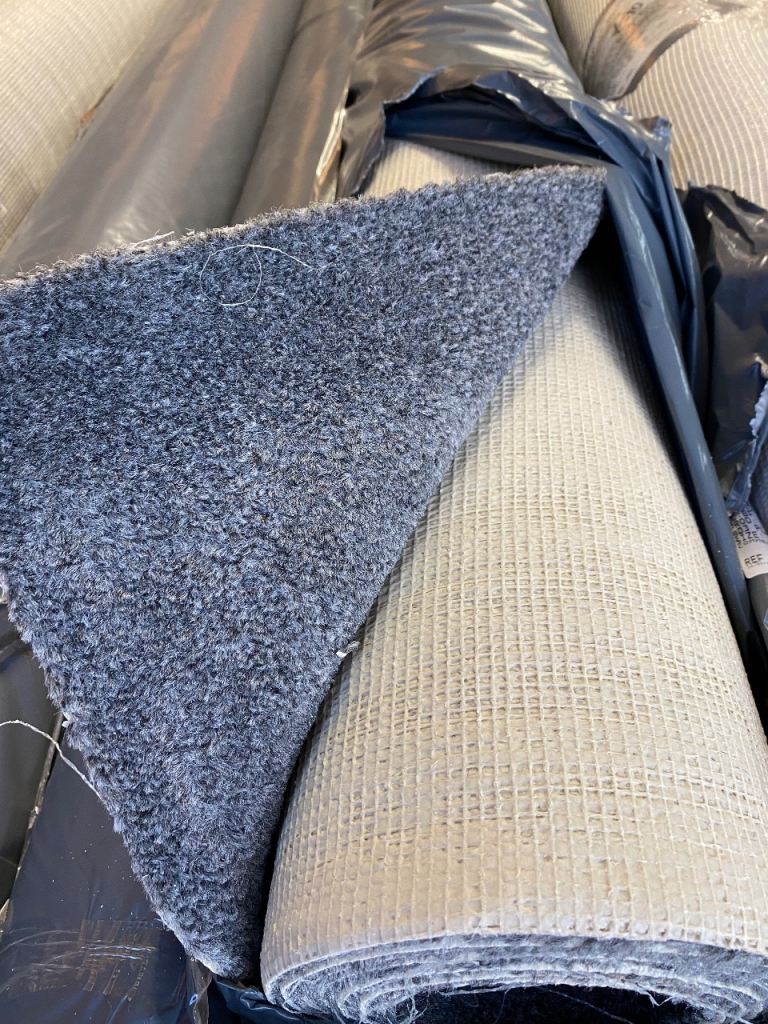 A new 3.45 x 5m dark grey carpet.