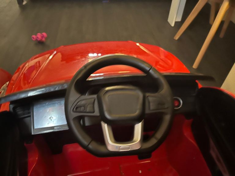 Red ride on car with tv video audio (open to offers)