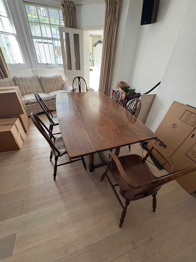 Oak dining table with six chairs