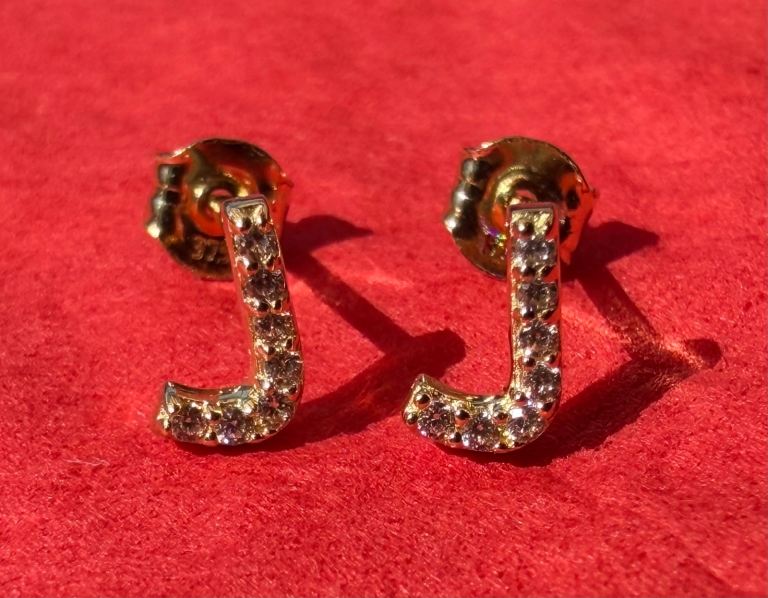 9ct solid gold Cubic Zirconia initial (J) Stud Earrings. Hallmarked on 2nd pic and others.