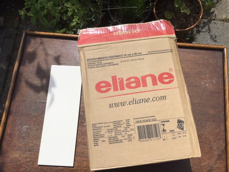 Part box (c 0.5sq m) of cream gloss ceramic linear tiles