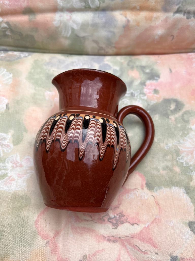 Ceramic pitcher with wavy pattern