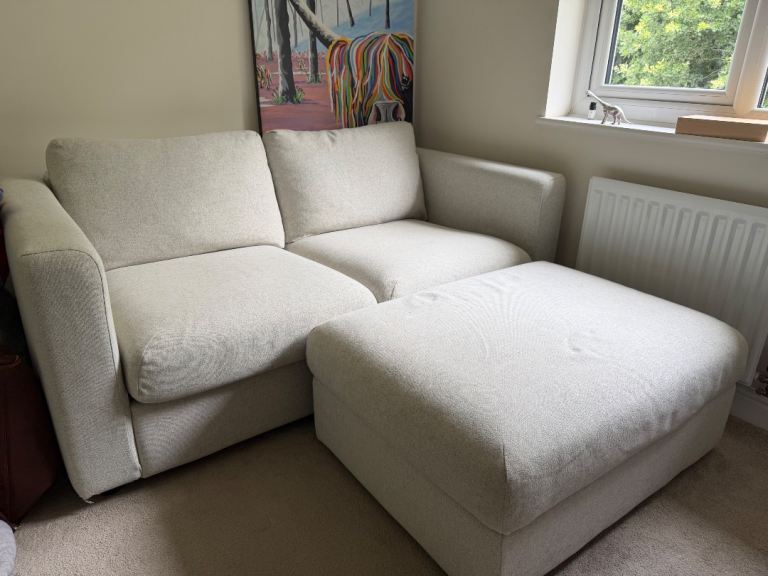 Cosy Beige Two-Seater Sofa with Matching Storage Footstool – Good Condition