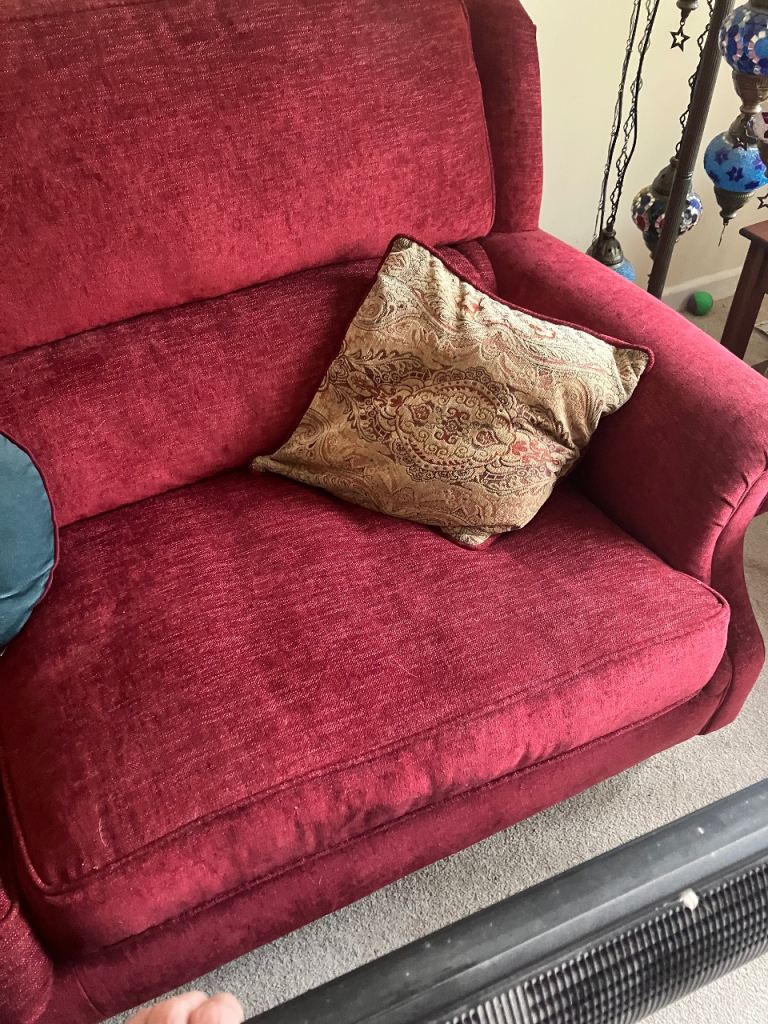 Comfortable Red Two-Seater Sofa – Good Condition