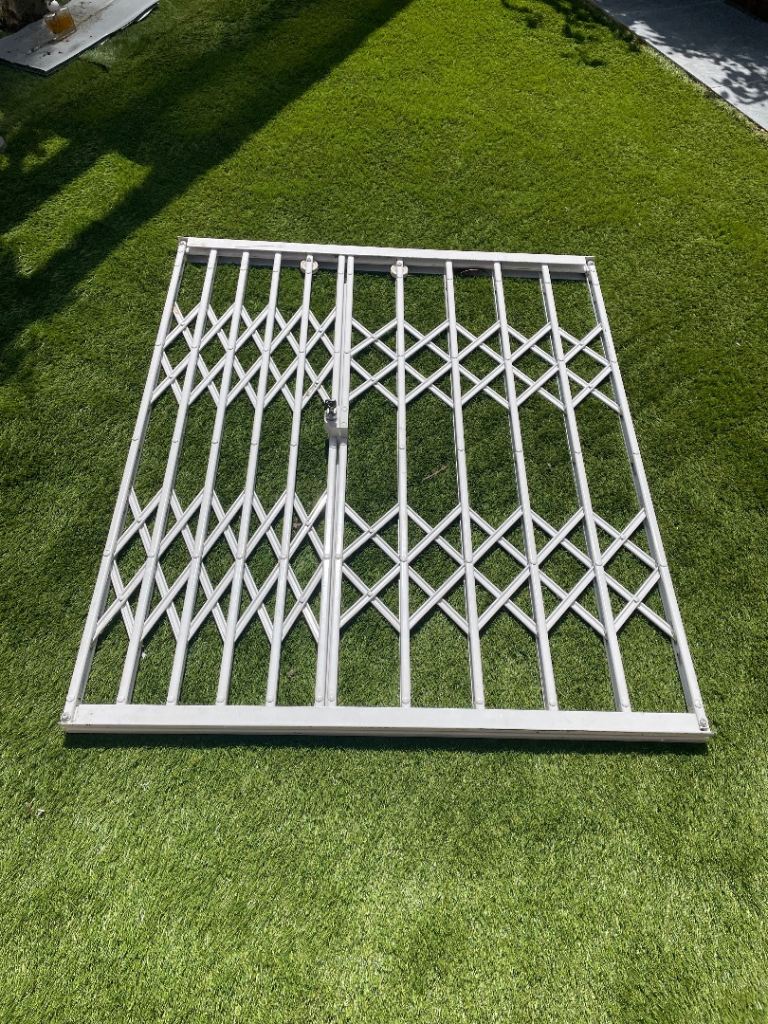 Retractable security grill for window