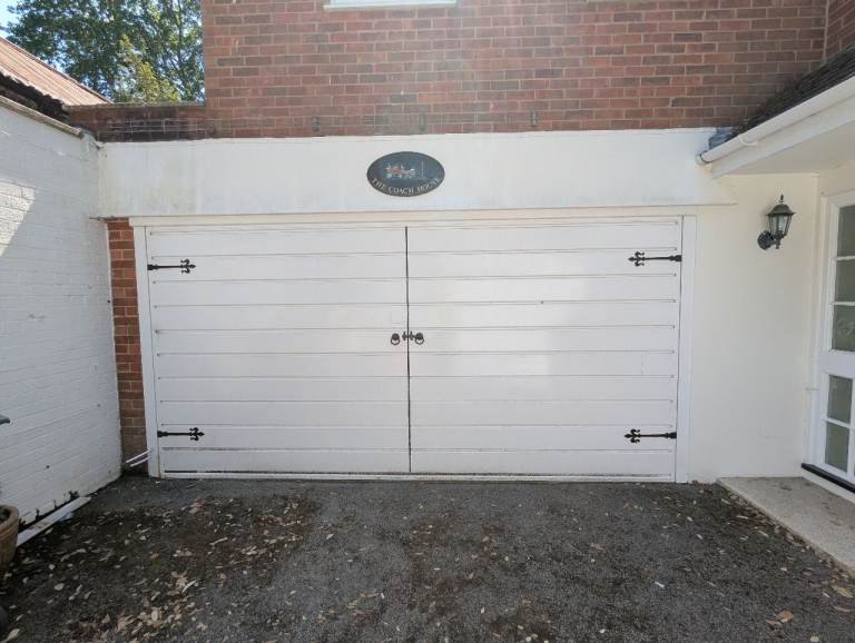 Up and over electric garage door.