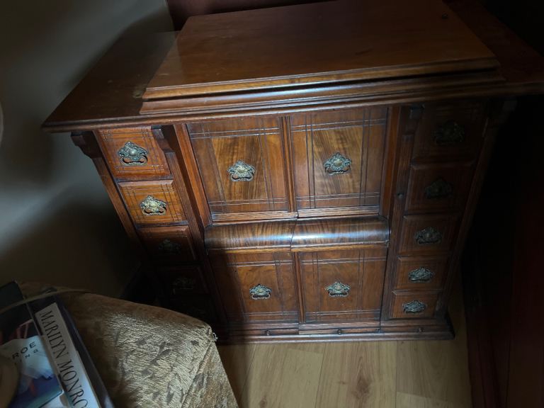 Singer sewing machine cabinet. Still has a sewing machine inside. 