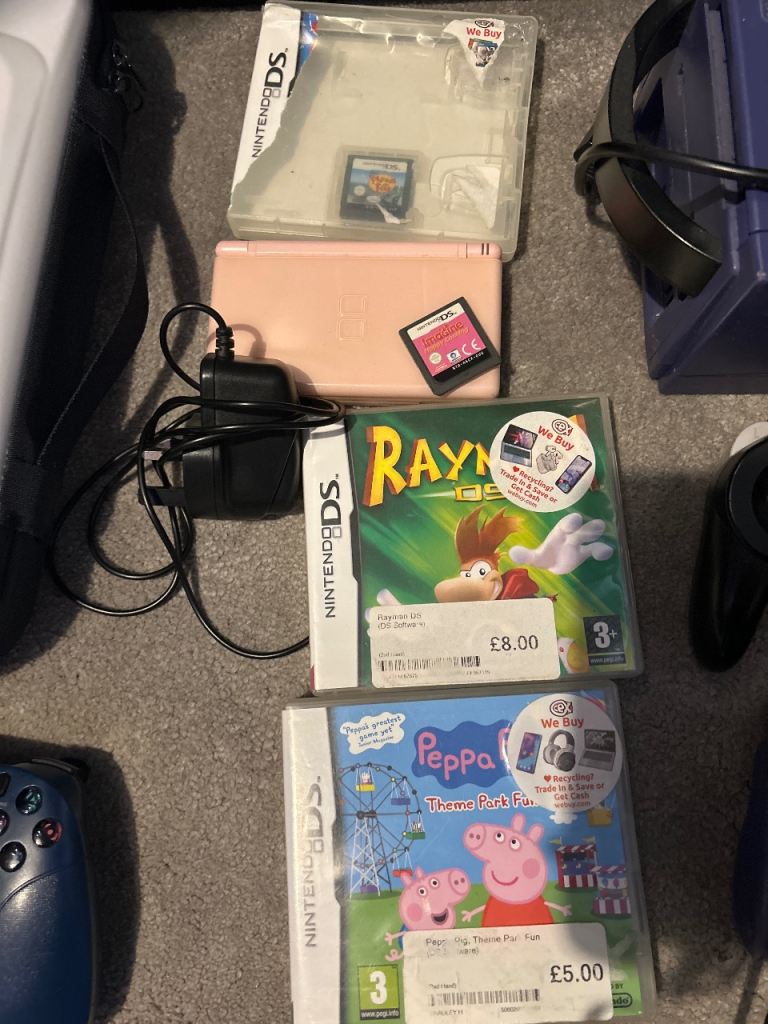 Pink Nintendo ds lite with four games and charger 