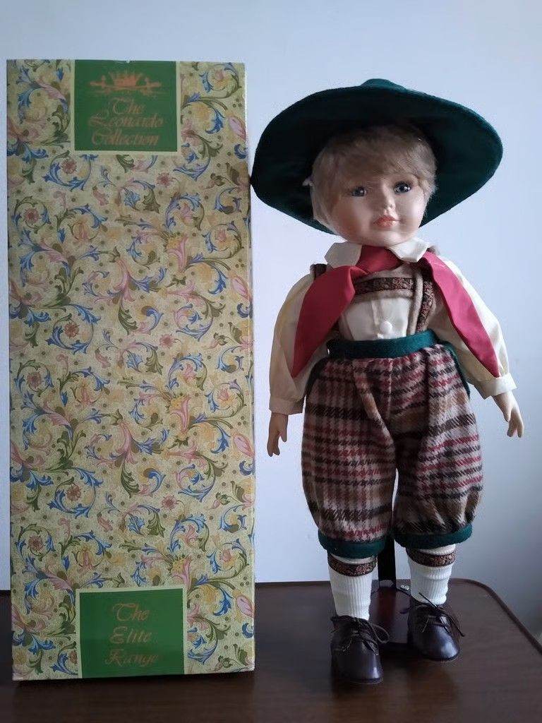 Leonardo Hand Painted Porcelain Dolls Brand New in original boxes with display stands