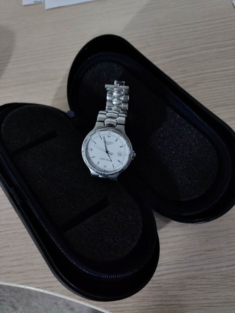 wrist watch by LONGINES stainless / white face V H P Quartz 