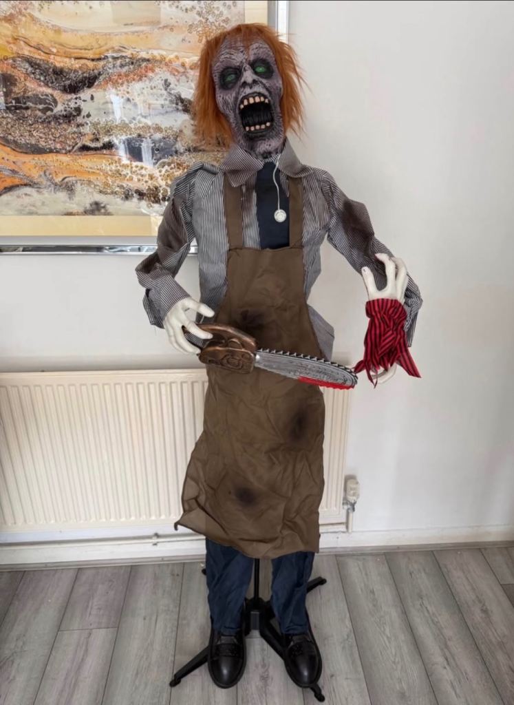 Large Zombie with chainsaw and cut off hand Animitronic 