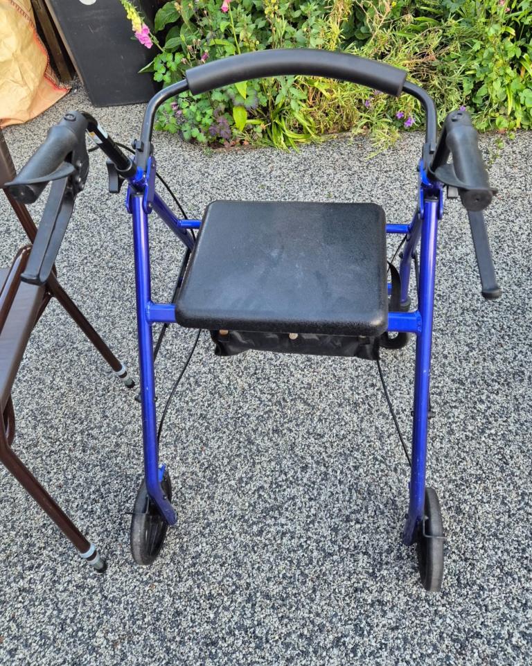 Blue Mobility Walker with Seat and Brakes – Good Condition