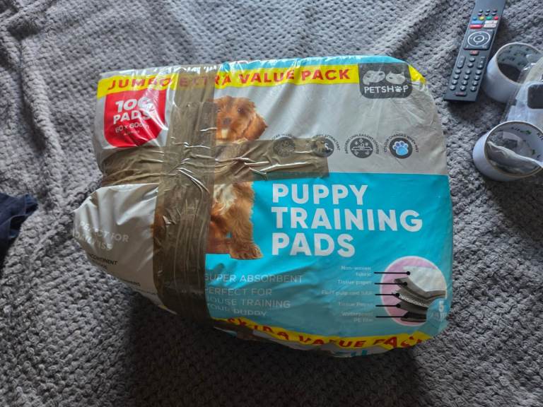 FREE puppy training pads (nearly a full pack. roughly about 80 pads)