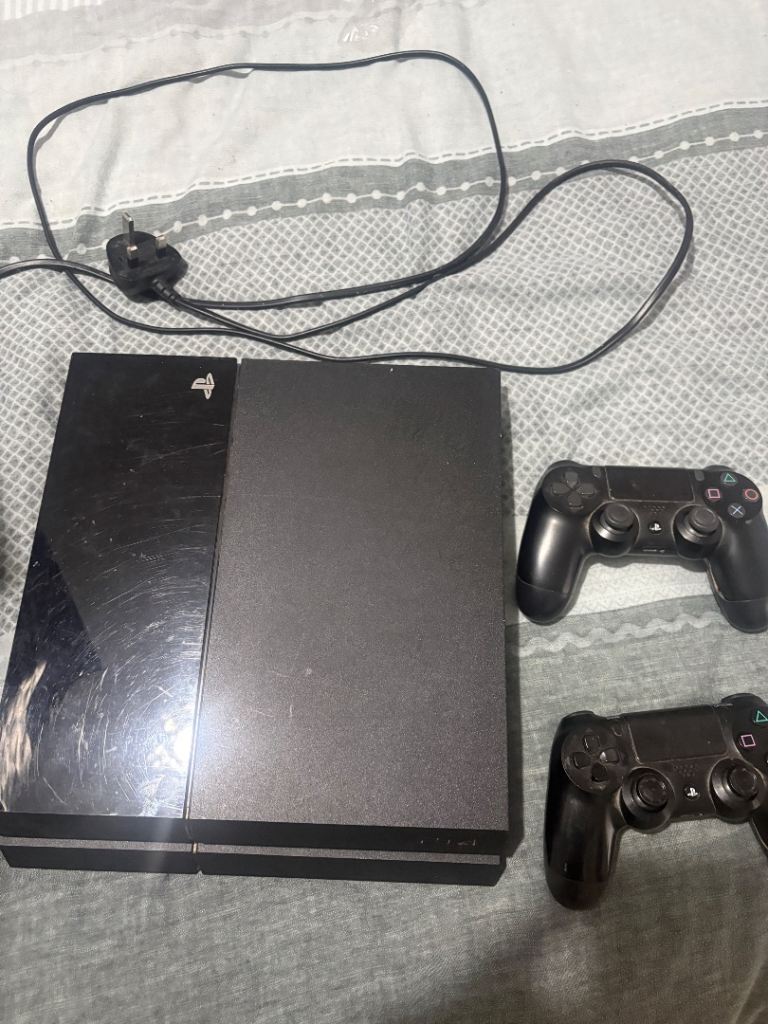 PlayStation 4 with 2 controllers and leads
