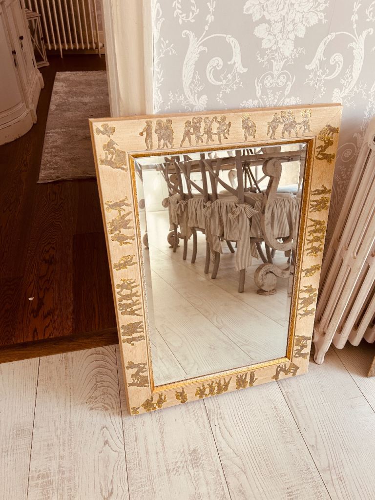 Mirror with dancing cherubs painted surround. 