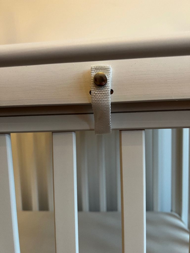 Cotbed, mattress and chest of drawers.