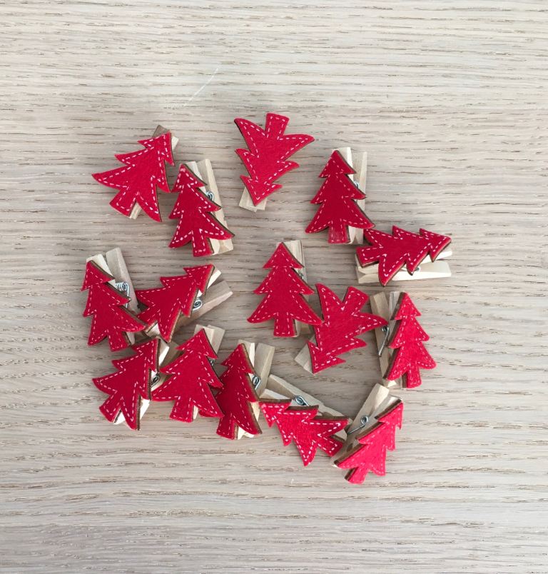 Fifteen miniature wooden card pegs