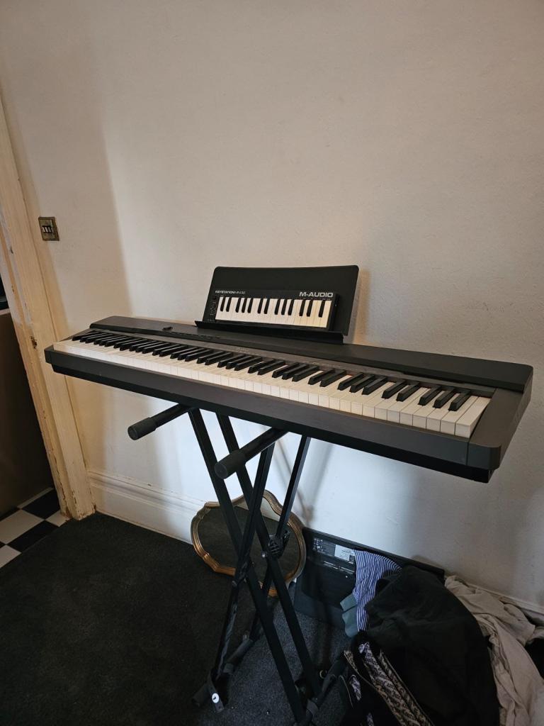 Casio Privia PX-130 piano with a stand