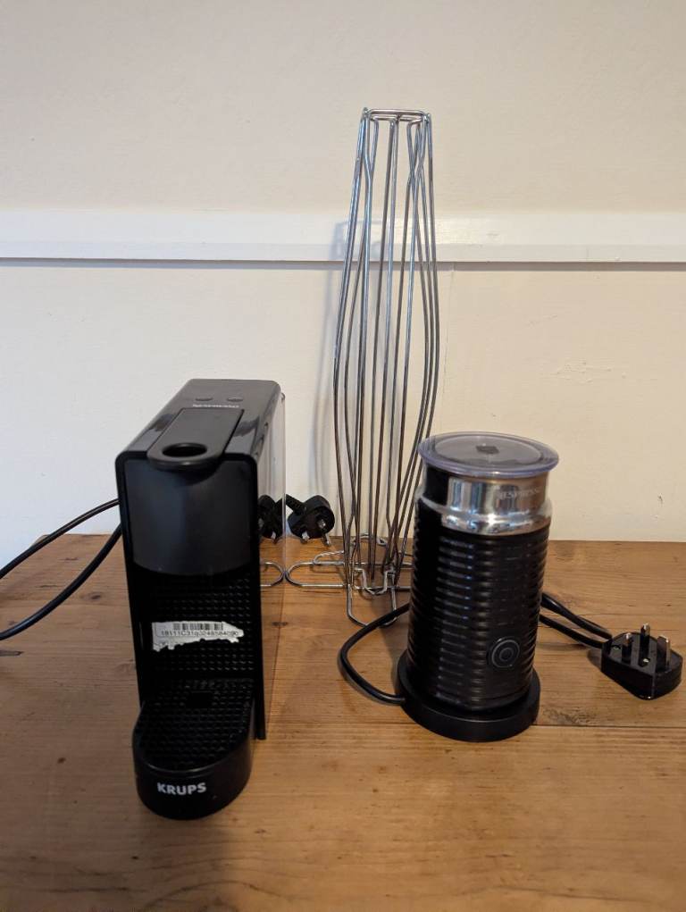 Pod coffee machine, milk frother, and pod holder