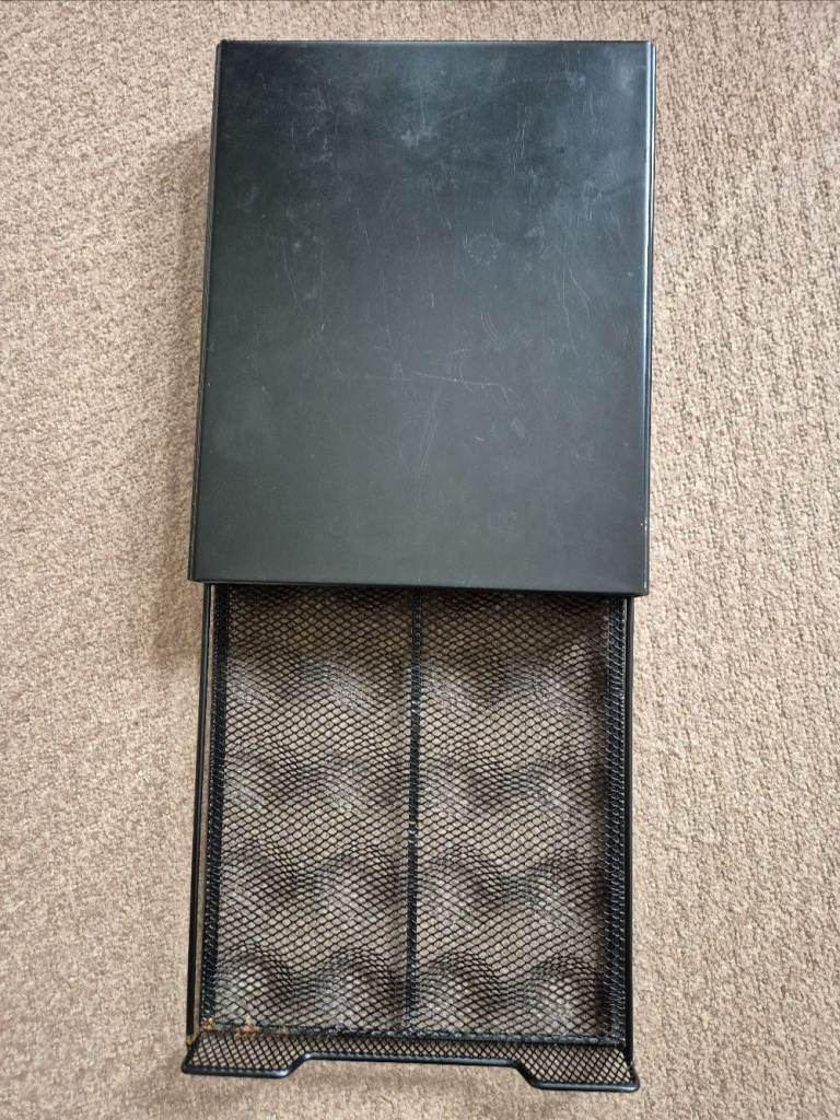 Black metal coffee pod holder - holds 16 pods, but unsure which ones

