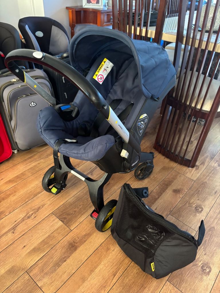 Doona+ 2 in 1 Stroller/Car Seat, includes rain cover, sun shade/protector & travel bag.