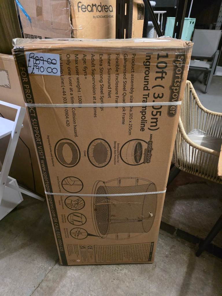 A new still boxed flat packed 10ft in ground trampoline featuring a 