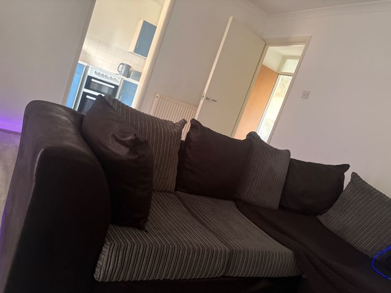 Matching black and grey Sofa set, corner sofa, foot stoll with storage, and spinning cuddle chair 