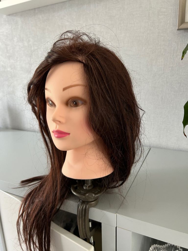 Hairdresser training head with clamp 