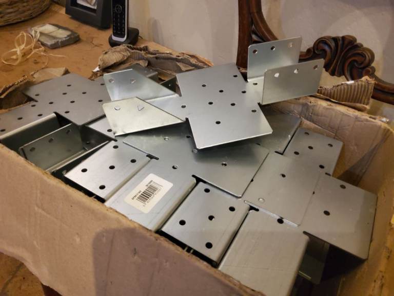 Adjustable slope joist hangers