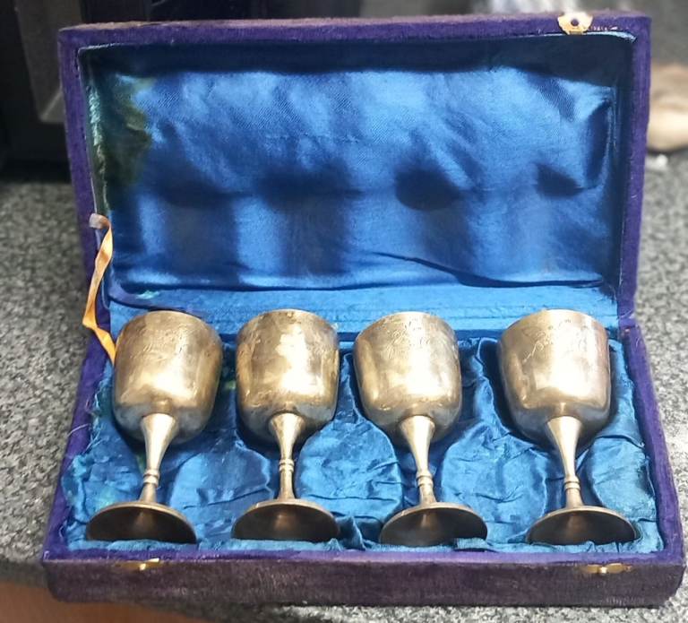 Elegant silver goblets in a blue velvet-lined case