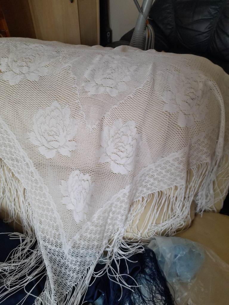 Lovely large lacy fringed  white shawl  . Never worn 