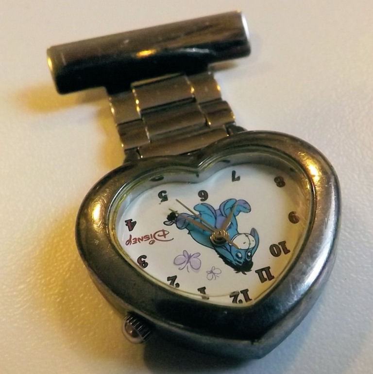DISNEY EEOYRE QUARTZ LAPEL FOB WATCH in GOOD WORKING ORDER