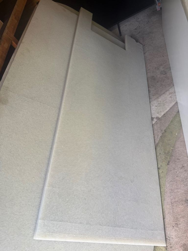 Composite worktop in a very pale green colour