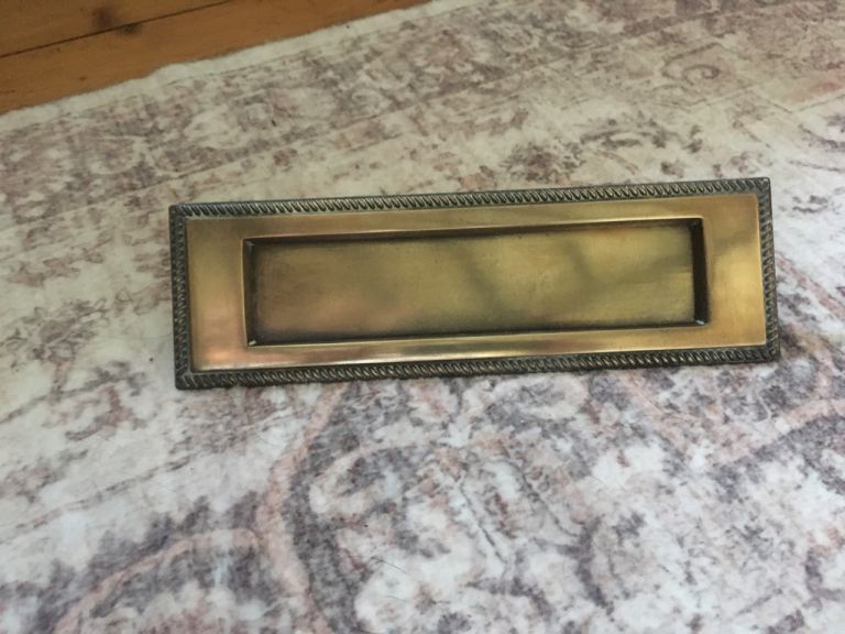 Antique brass letter box