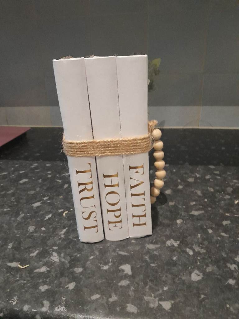 Decorative White Books with 'Trust Hope Faith' Text