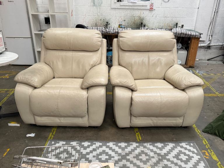 Two white leather sofa chairs