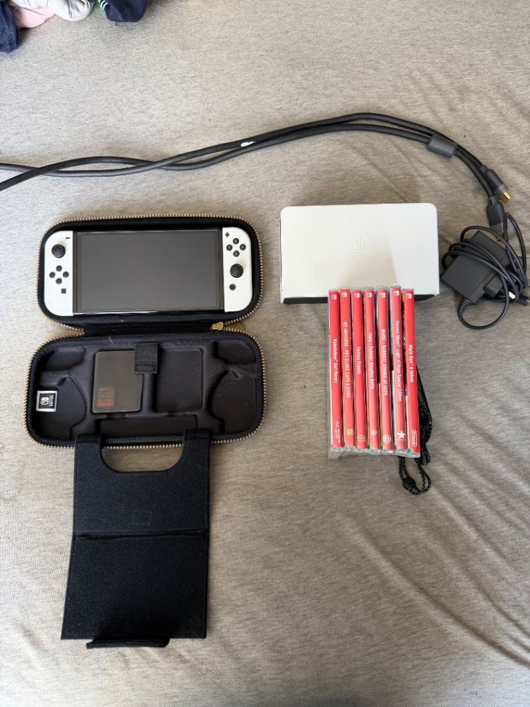 Nintendo Switch OLED with 8 Games and Accessories – Excellent Condition