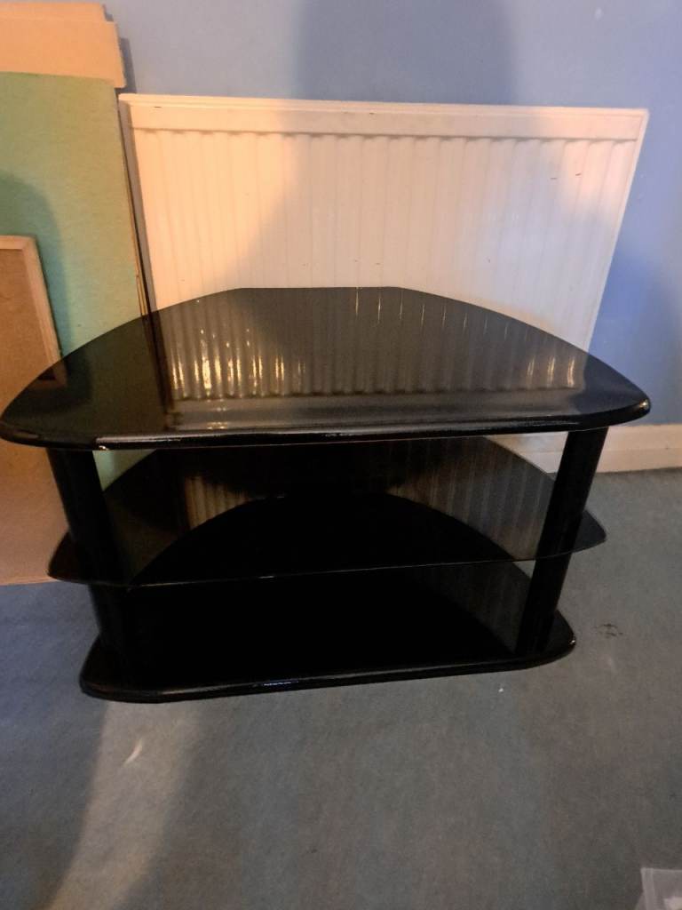 image for dark wood tv stand with wood top and dark glass shelve underneath