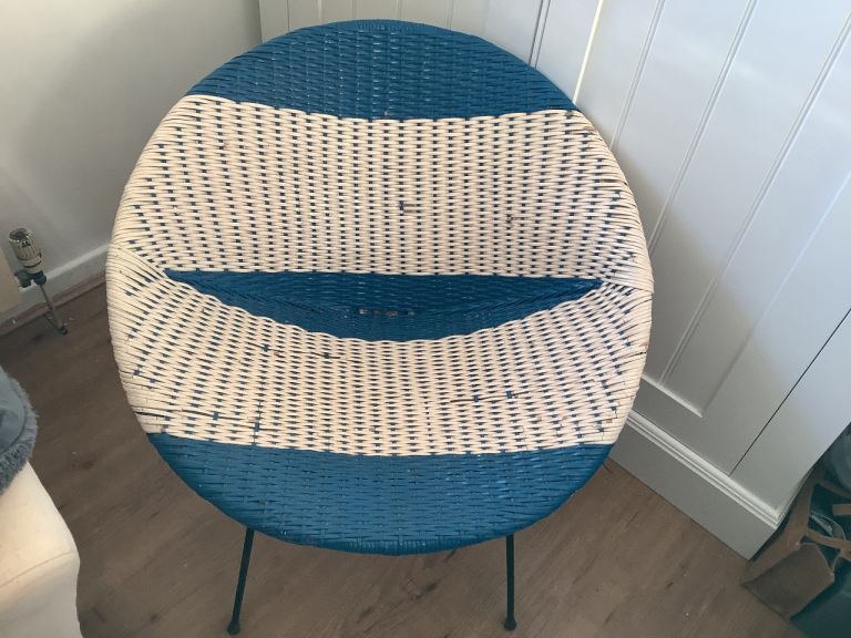 Vintage, retro plastic blue and white striped chair.