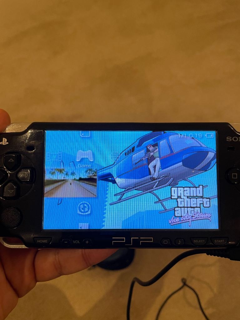 PSP SLIM 2000 with games, official camera and accessories
