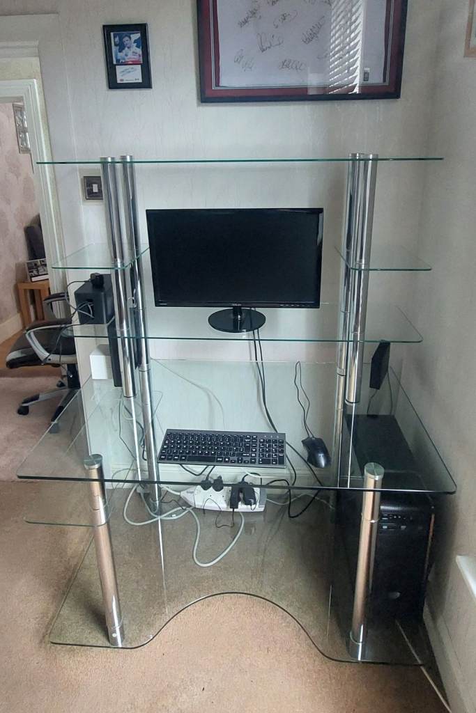 Glass computer desk.