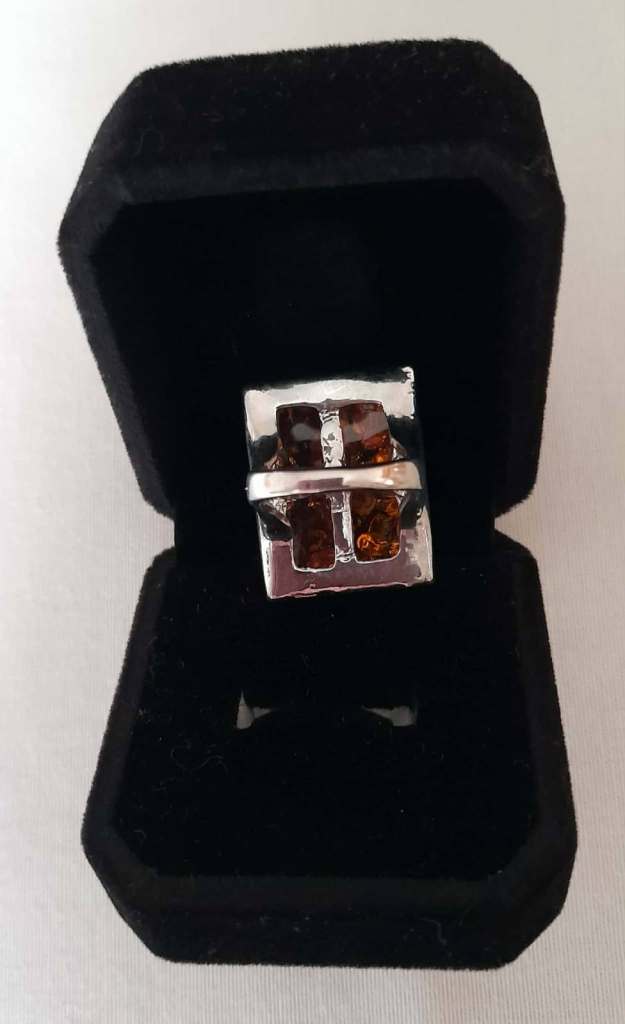 Imitation opal ring in black velvet box 