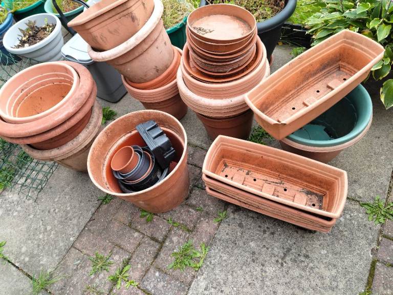 Used pots and trays and off cuts of green mesh 