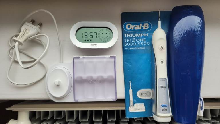 As new, excellent condition, Oral-B Triumph TriZone5500 electric rechargeable toothbrush&accessories